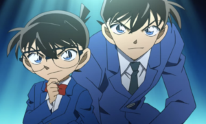 Detective Conan and Shinichi Kudo posing in school uniform